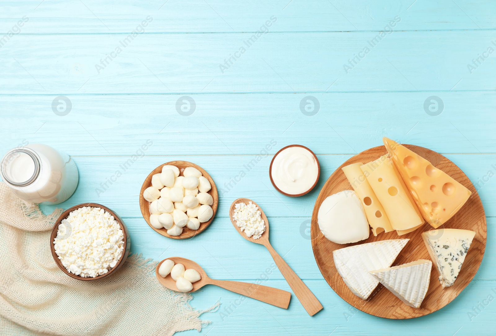 Photo of Flat lay composition with different dairy products on wooden background