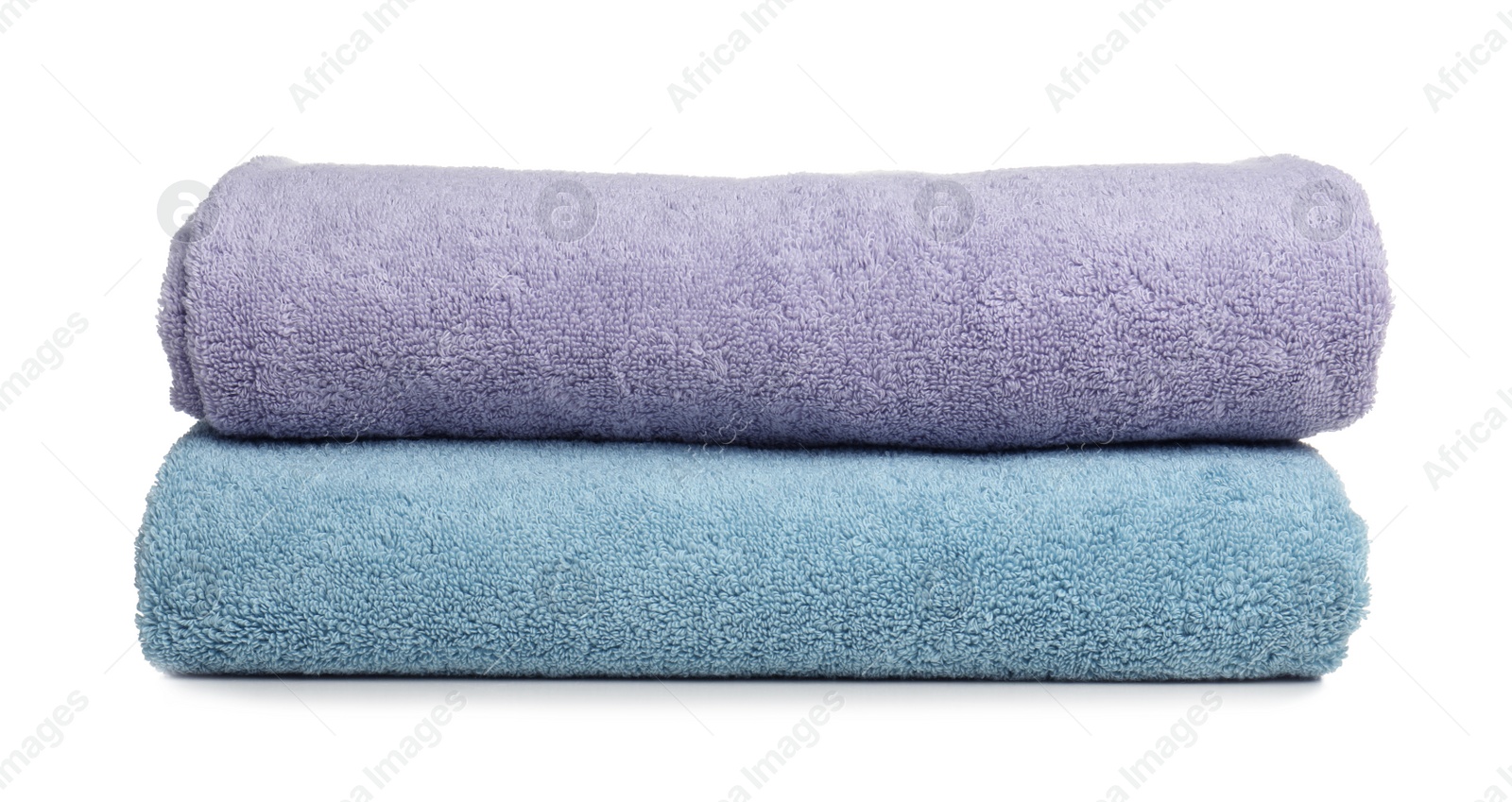 Photo of Folded soft terry towels on white background