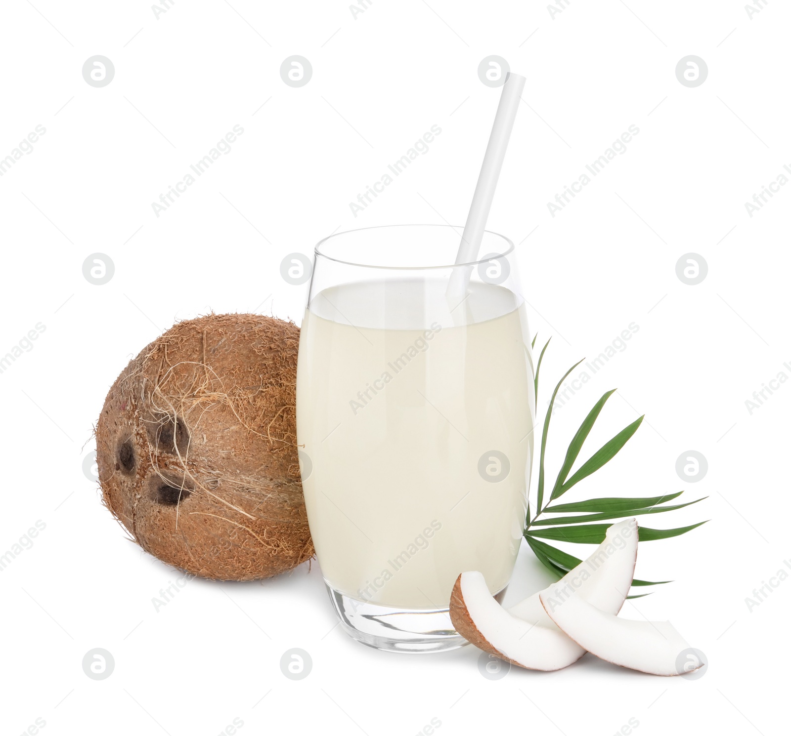 Photo of Glass of coconut water, leaf and nuts isolated on white