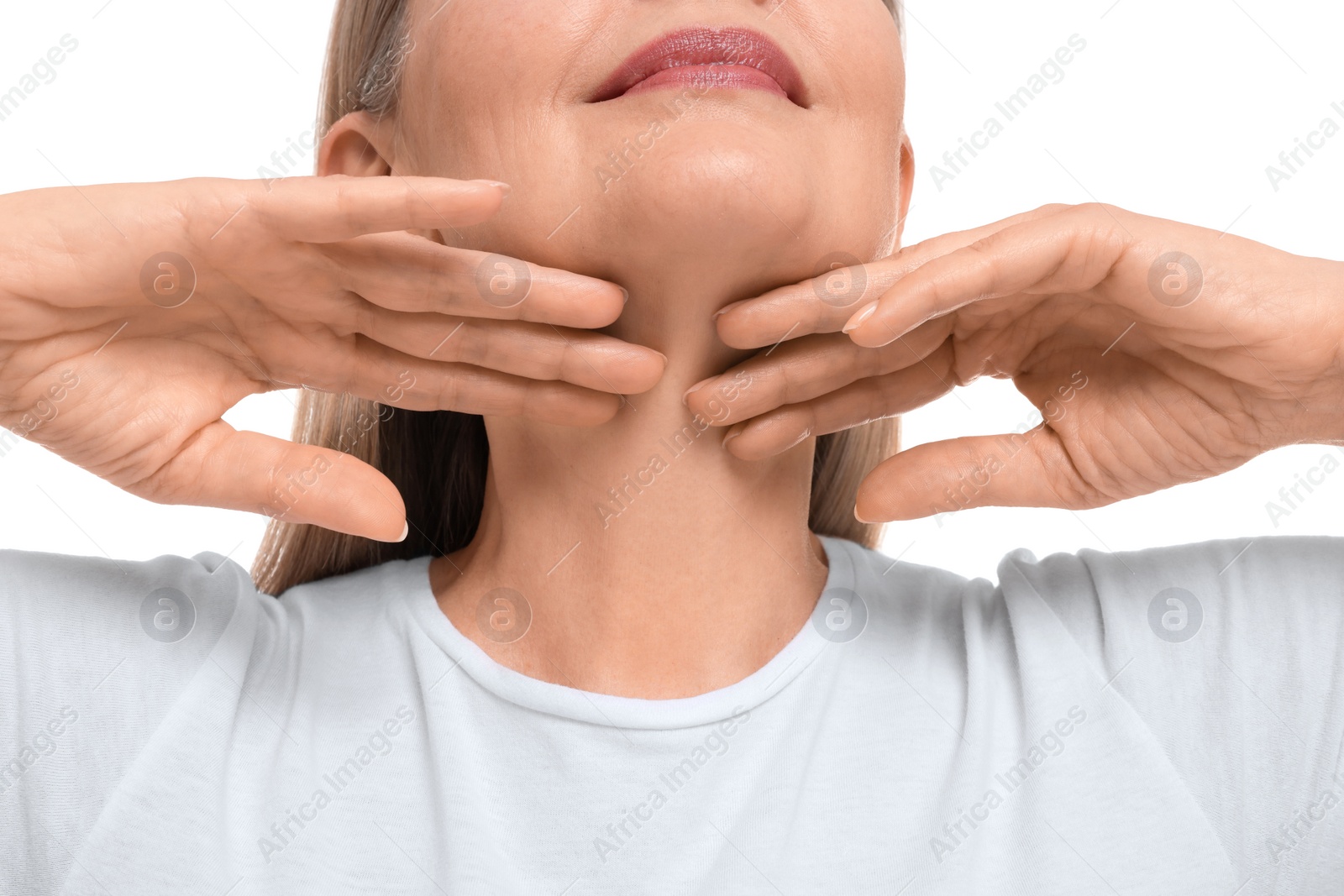 Photo of Mature woman touching her neck on white background, closeup