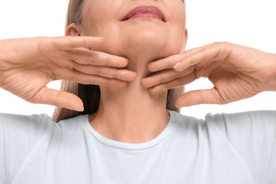 Mature woman touching her neck on white background, closeup