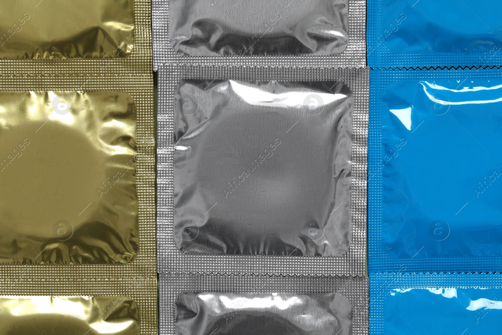 Photo of Condom packages as background, top view. Safe sex