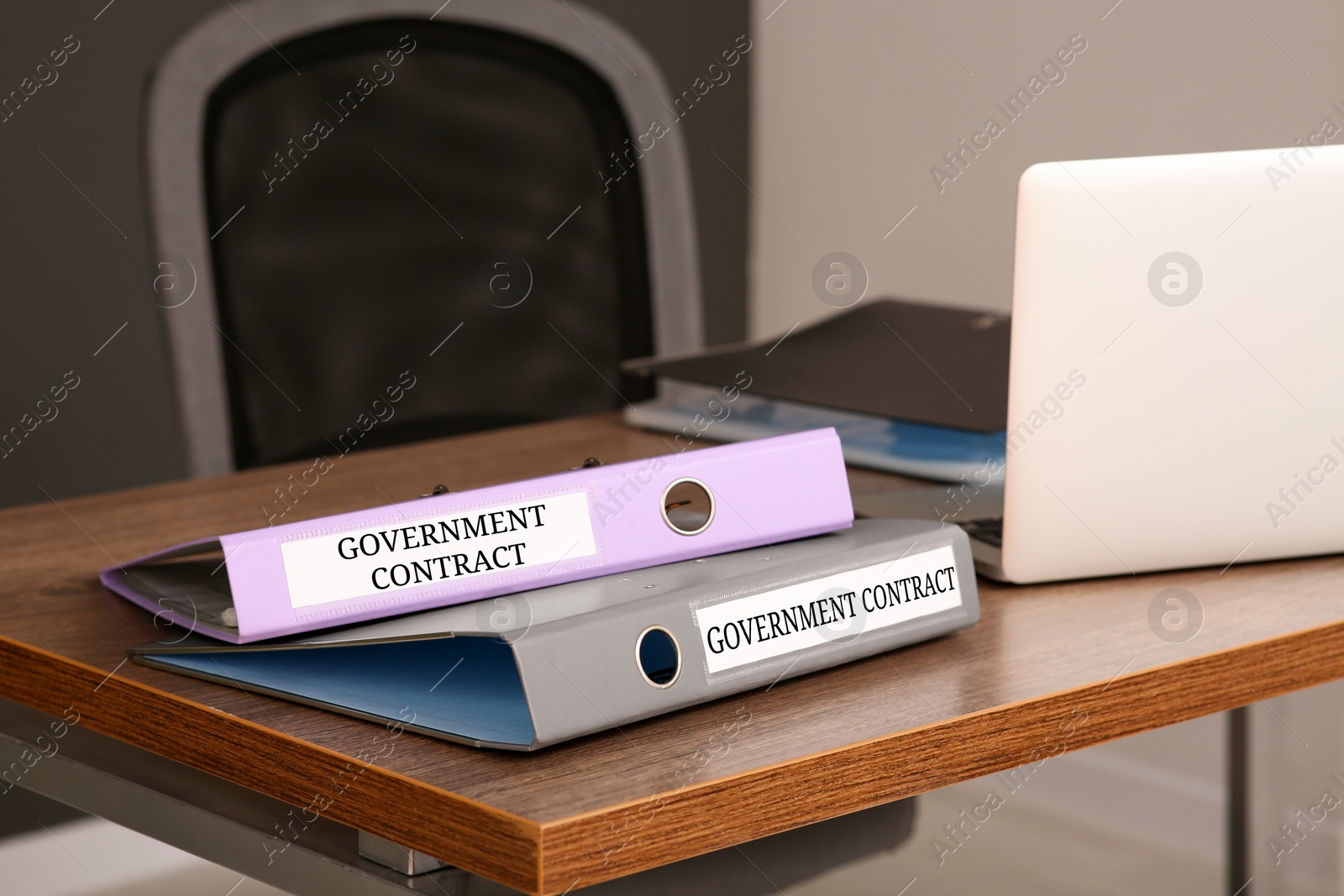 Image of Folders with Government Contract labels on desk in office