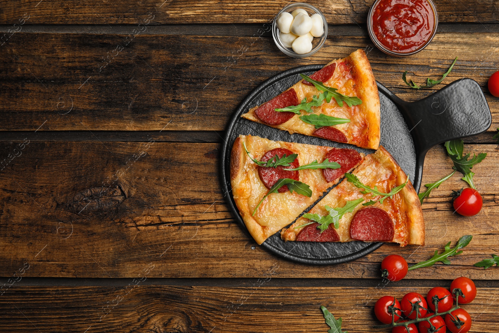 Photo of Flat lay composition with tasty pepperoni pizza on wooden table. Space for text