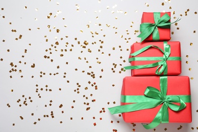 Photo of Christmas tree made with different gift boxes on white background, flat lay. Space for text