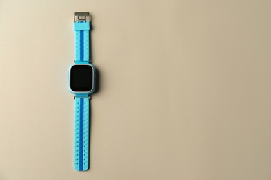 Photo of Kid smart watch on grey background, top view. Space for text