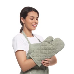 Woman wearing green apron and oven glove on white background