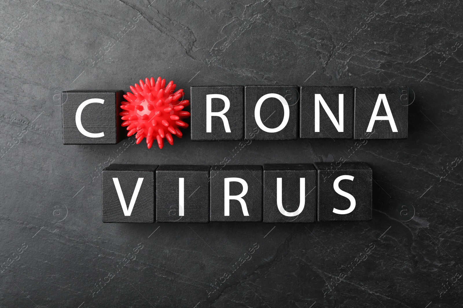 Photo of Cubes with phrase CORONA VIRUS on black background, flat lay