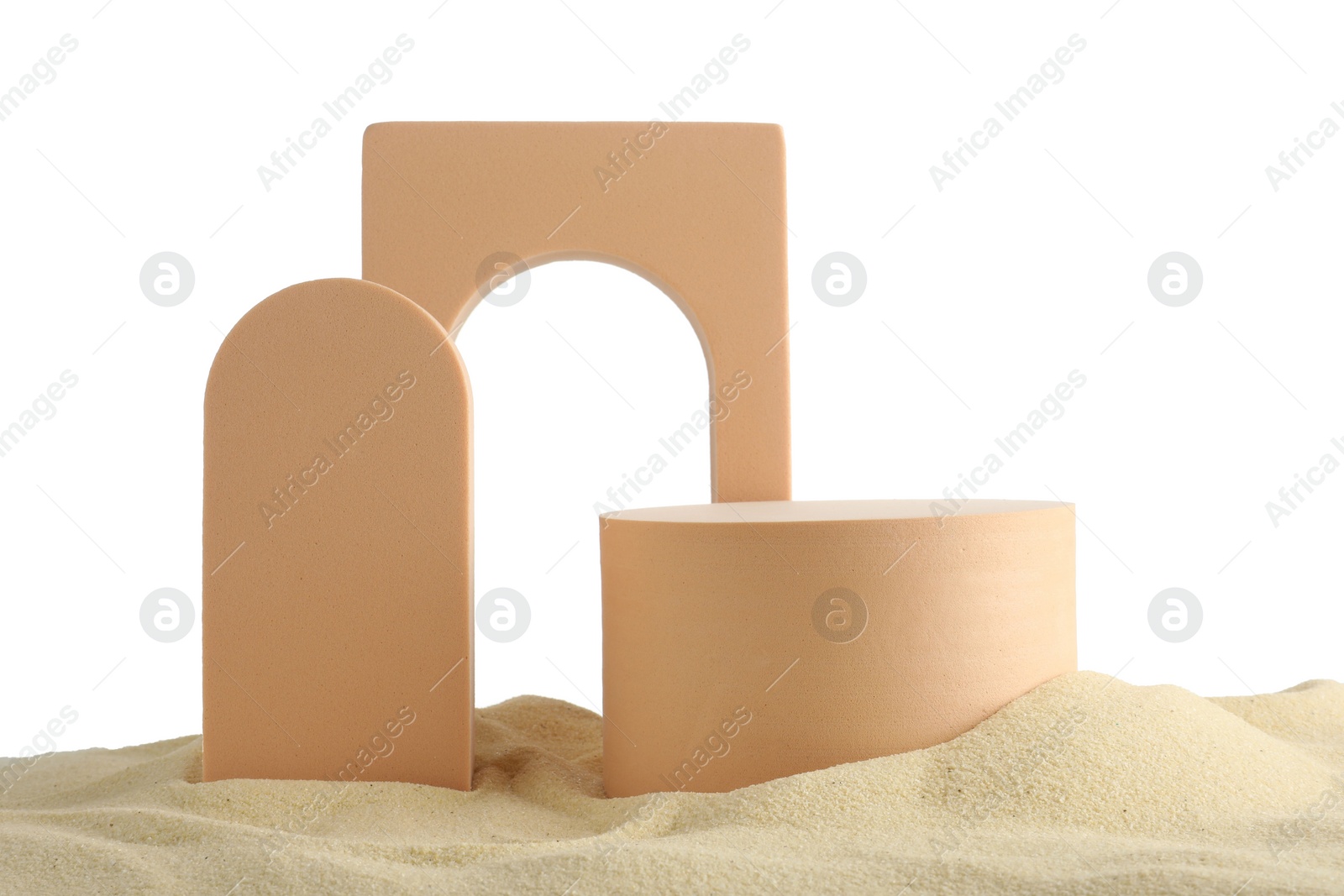 Photo of Presentation of product. Different podiums on sand against white background