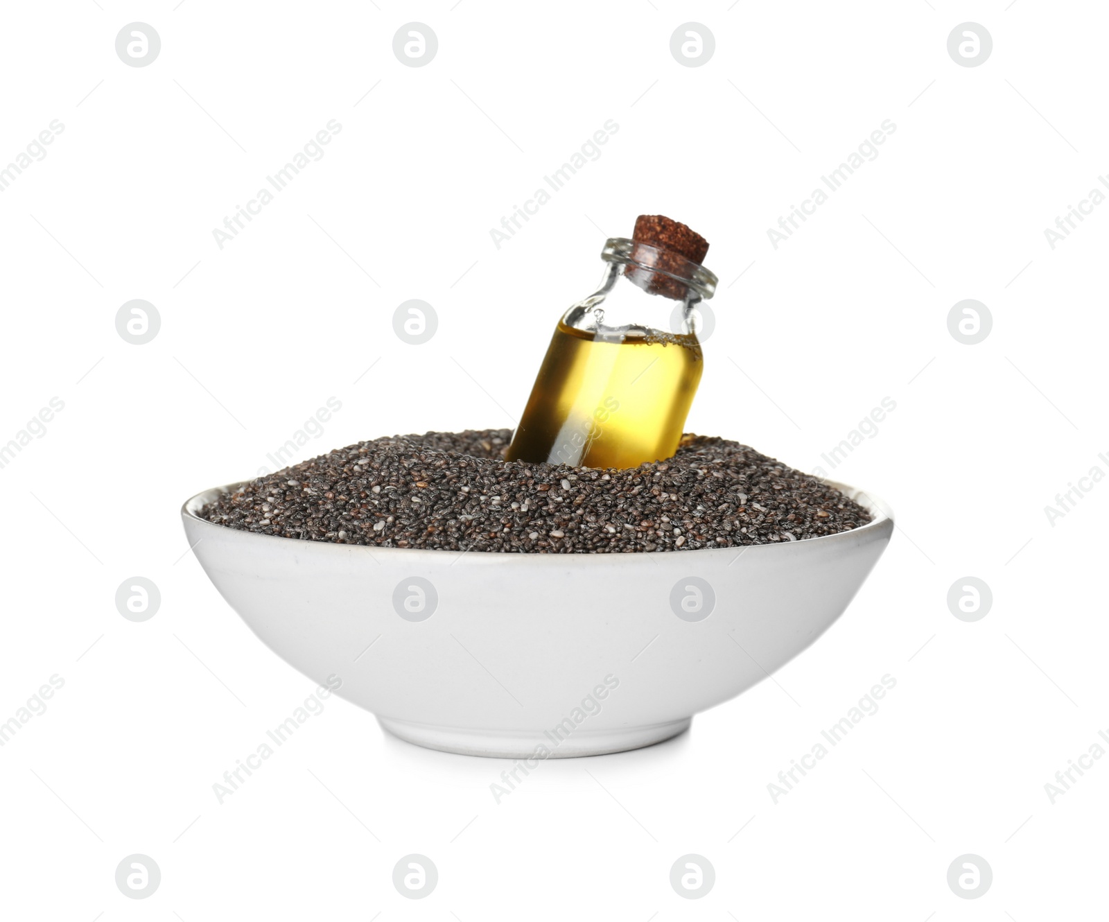 Photo of Bottle of chia oil in bowl with seeds isolated on white