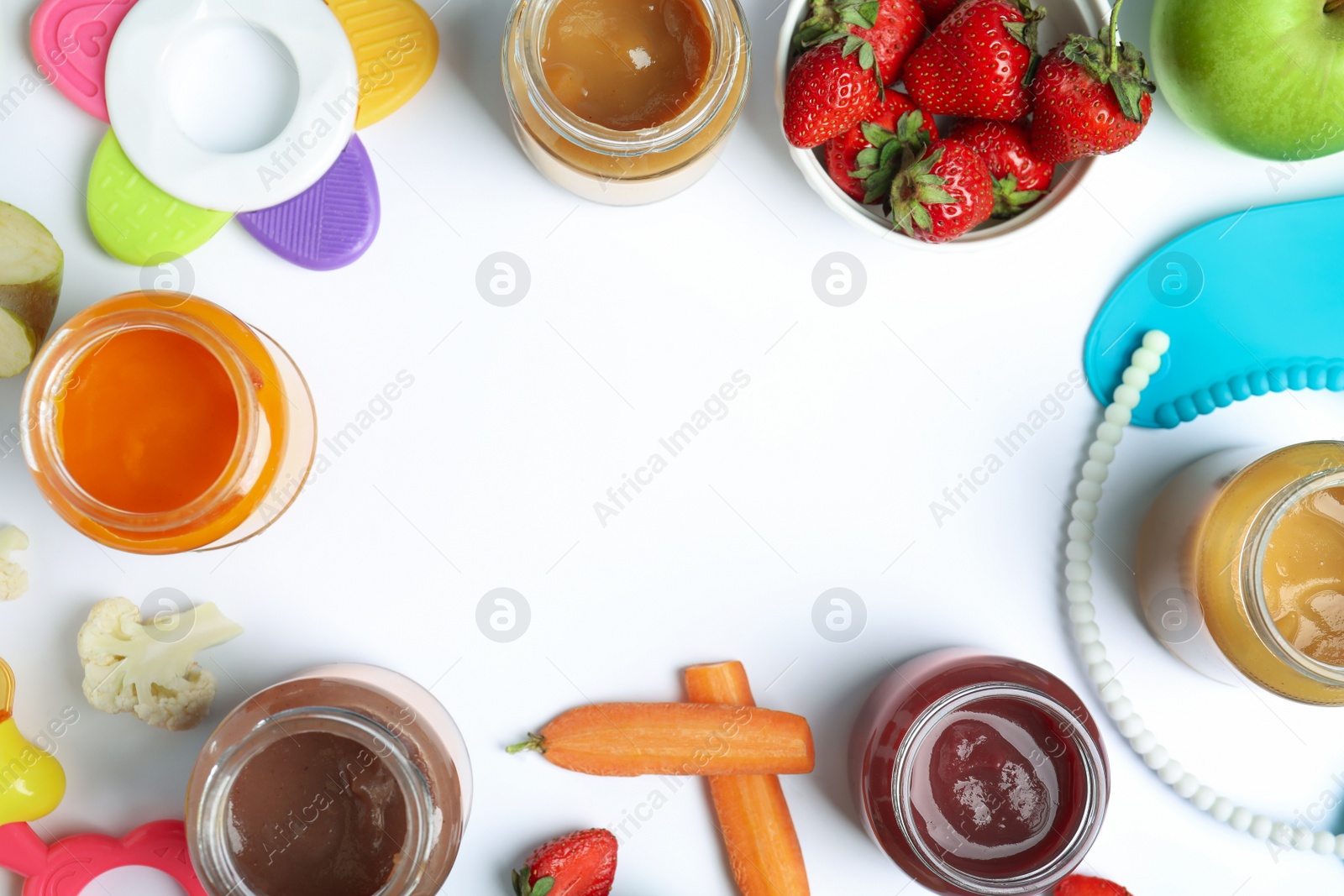 Photo of Frame of baby food, ingredients and accessories on white background, flat lay. Space for text