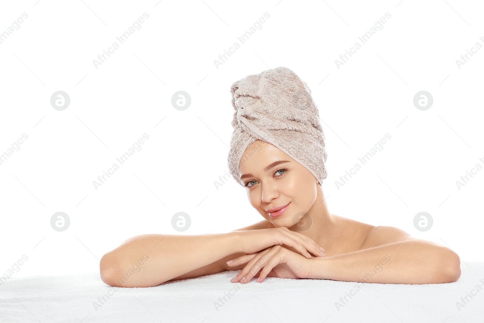 Photo of Portrait of young pretty woman with towel on white background