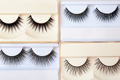 Different types of false eyelashes in packs, top view