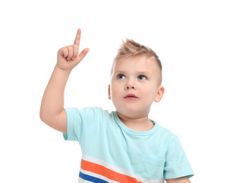 Photo of Cute little boy posing on white background