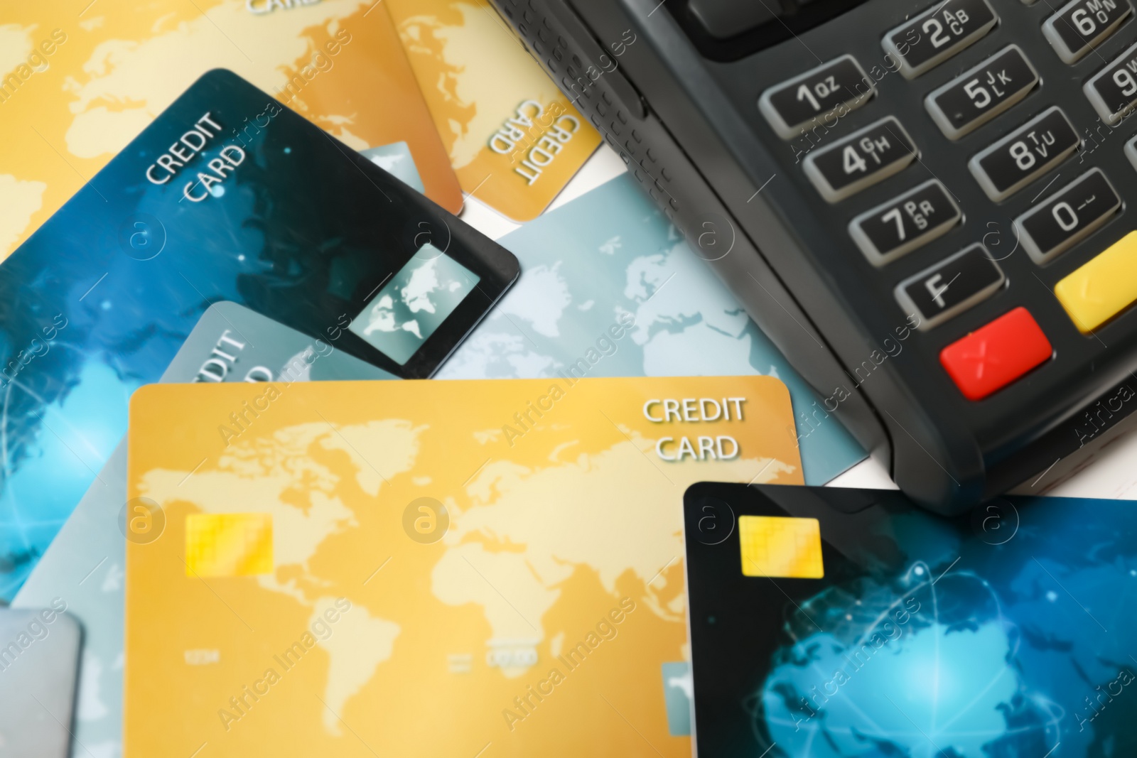 Photo of Many different credit cards and payment terminal, closeup