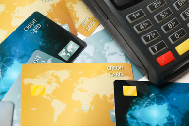 Photo of Many different credit cards and payment terminal, closeup