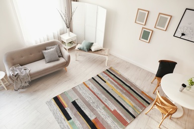 Living room interior with comfortable sofa, view through CCTV camera