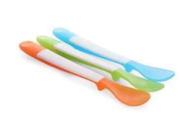 Photo of Plastic spoons on white background. Serving baby food