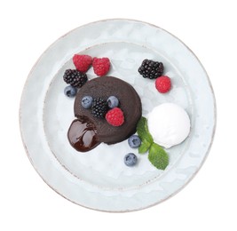 Photo of Delicious chocolate fondant served with fresh berries and ice cream isolated on white, top view