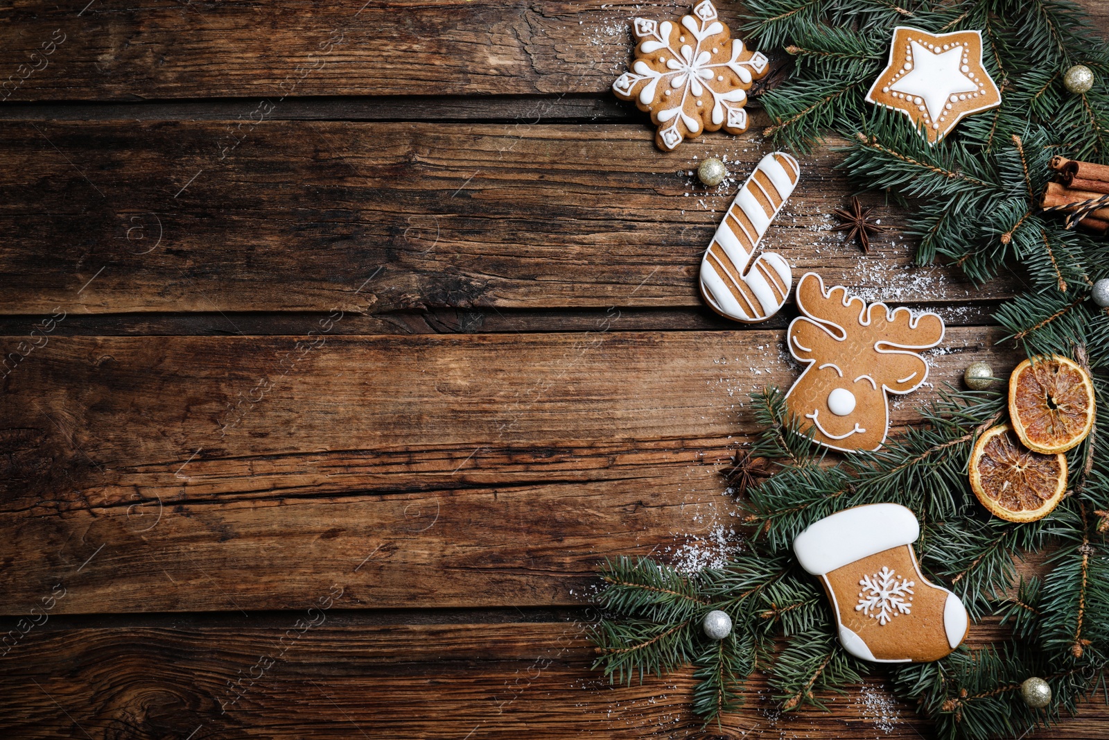 Photo of Flat lay composition with tasty Christmas cookies on wooden table, space for text