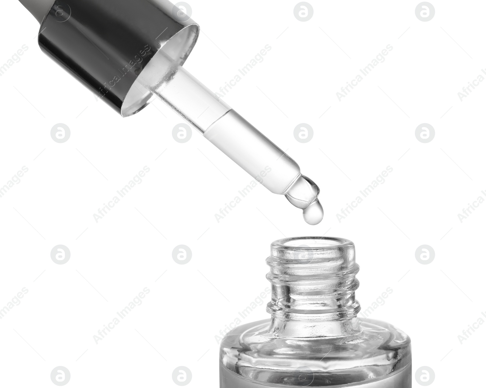 Photo of Dripping essential oil from pipette into glass bottle on white background