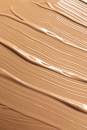 Photo of Texture of skin foundation as background, closeup