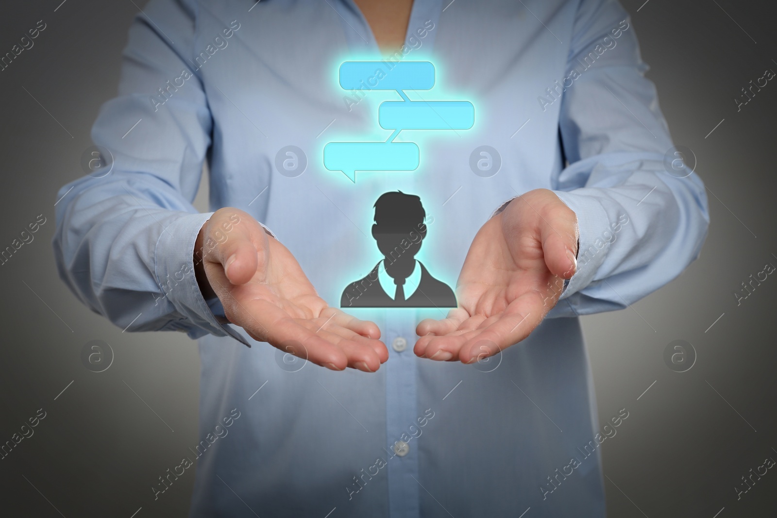 Image of Communication and dialogue concept. Woman holding illustration of faceless man with speech bubbles on grey background, closeup