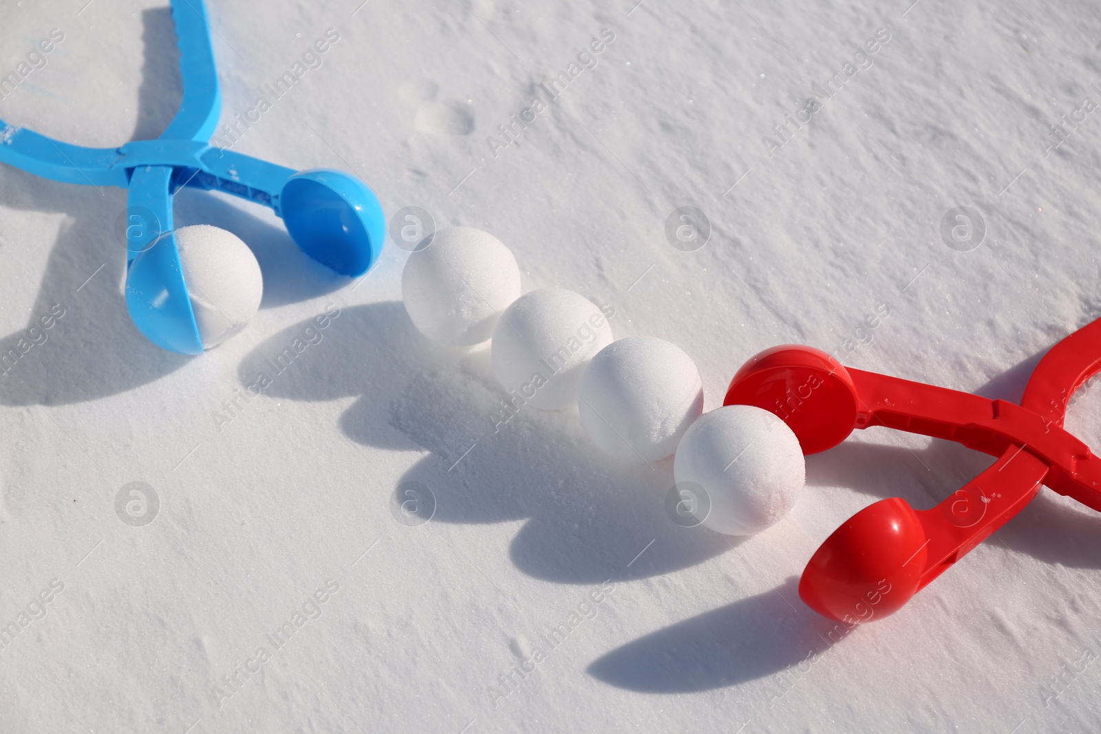 Photo of Snowballs and plastic tools outdoors on winter day