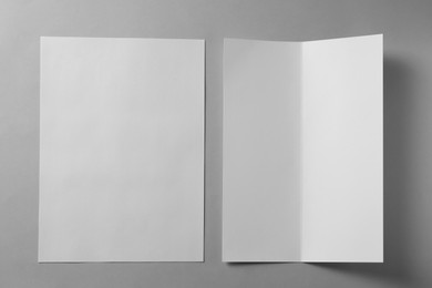 Blank paper sheets for brochure on light grey background, flat lay