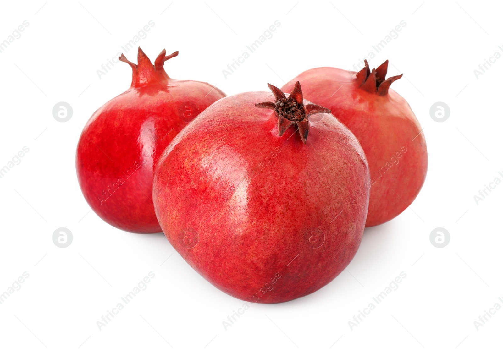 Photo of Many fresh ripe pomegranates isolated on white