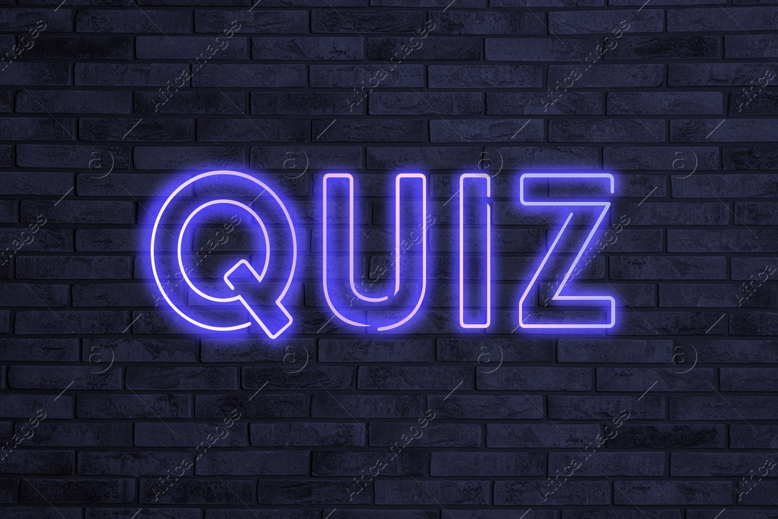 Image of Word QUIZ made of neon letters on black brick background