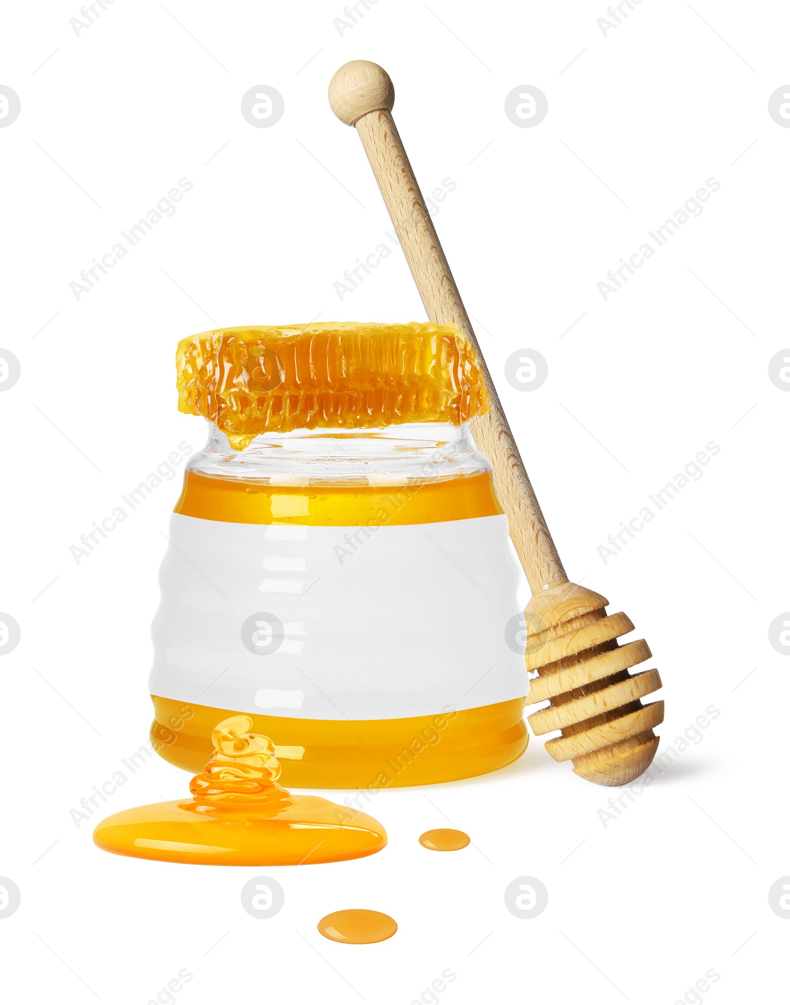 Image of Sweet honey in glass jar with blank label, wooden honey dipper and piece of honeycomb on white background. Mockup for design