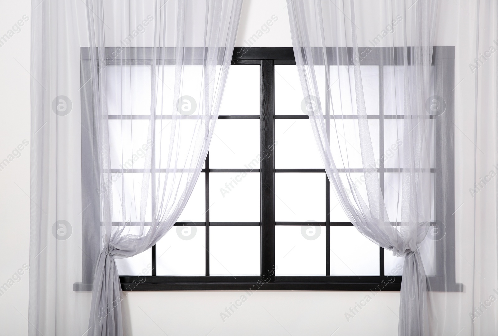 Photo of Window frame with glass and curtains. Home interior