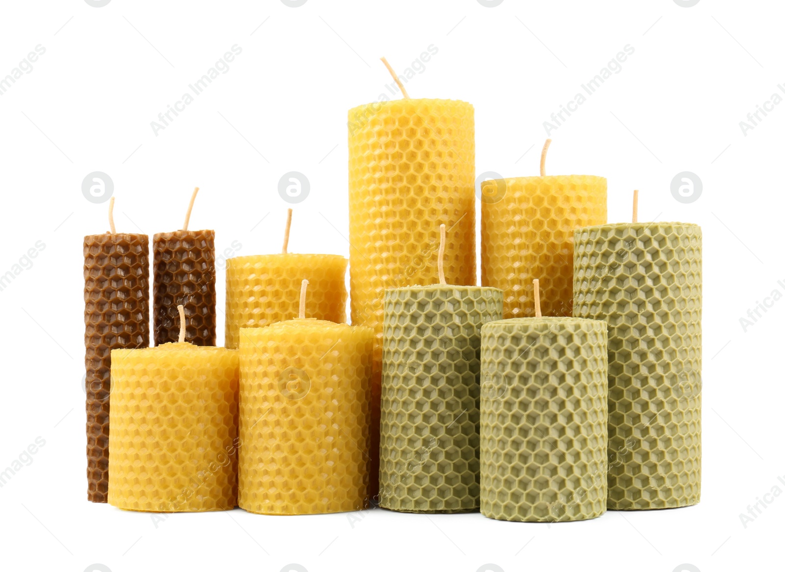 Photo of Stylish elegant beeswax candles isolated on white