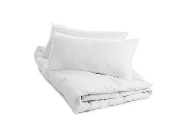 Photo of Soft blanket and pillows on white background