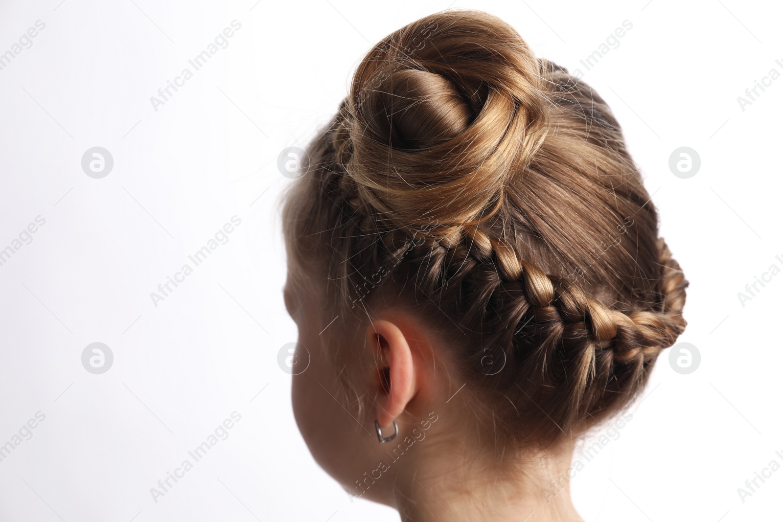 Photo of Little girl with braided hair on white background, closeup. Space for text