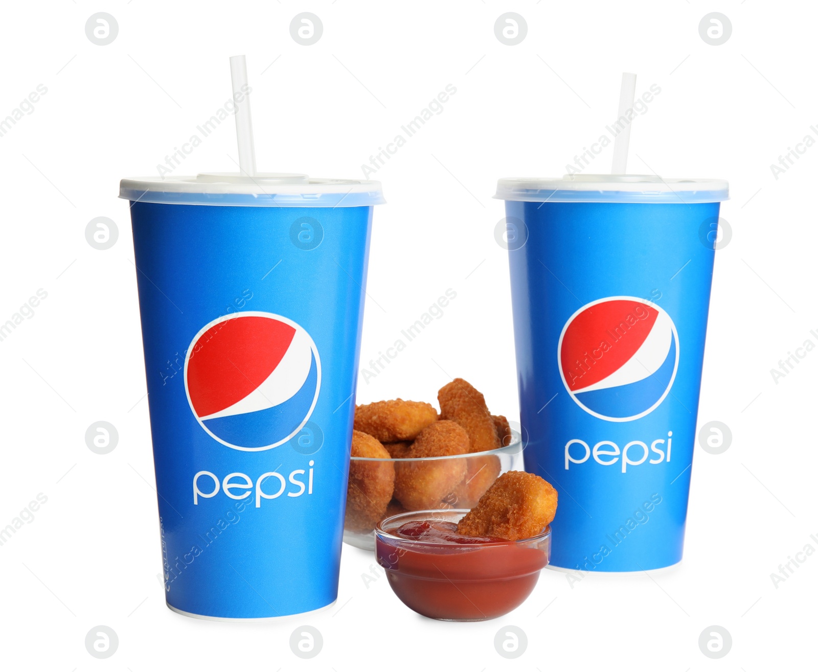 Photo of MYKOLAIV, UKRAINE - FEBRUARY 16, 2021: Cups of Pepsi, chicken nuggets and dip sauce isolated on white