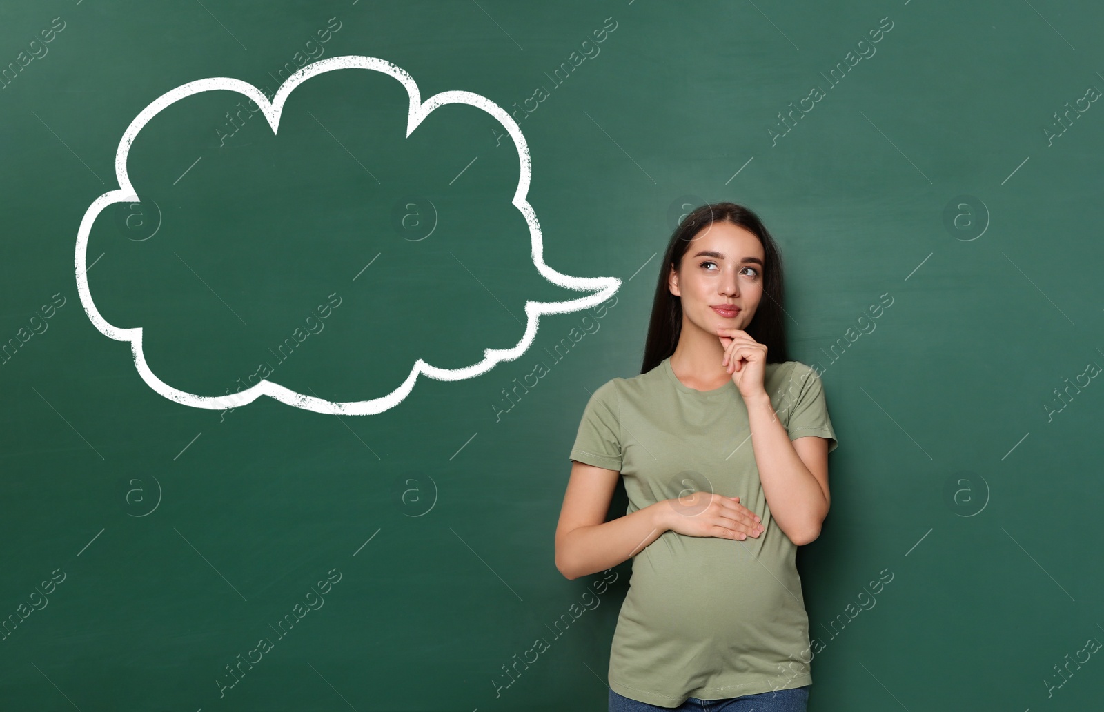 Image of Emotional pregnant woman choosing name for her child. Future mother near green chalkboard with empty thought cloud