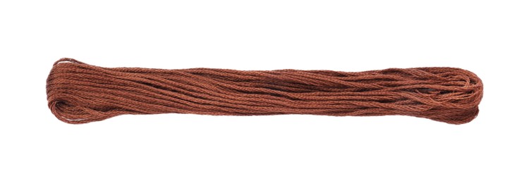 Photo of Bright brown embroidery thread on white background