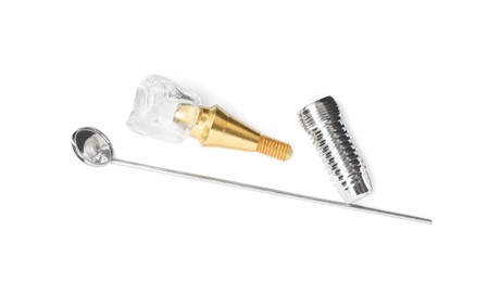 Parts of dental implant and mirror on white background, top view