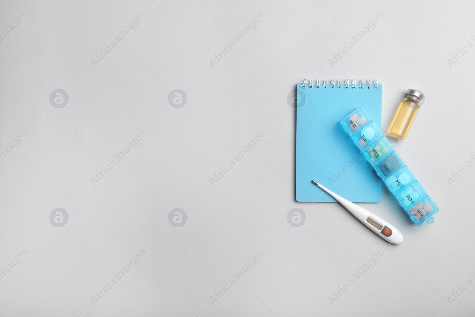 Photo of Flat lay composition with medical items and space for text on gray background