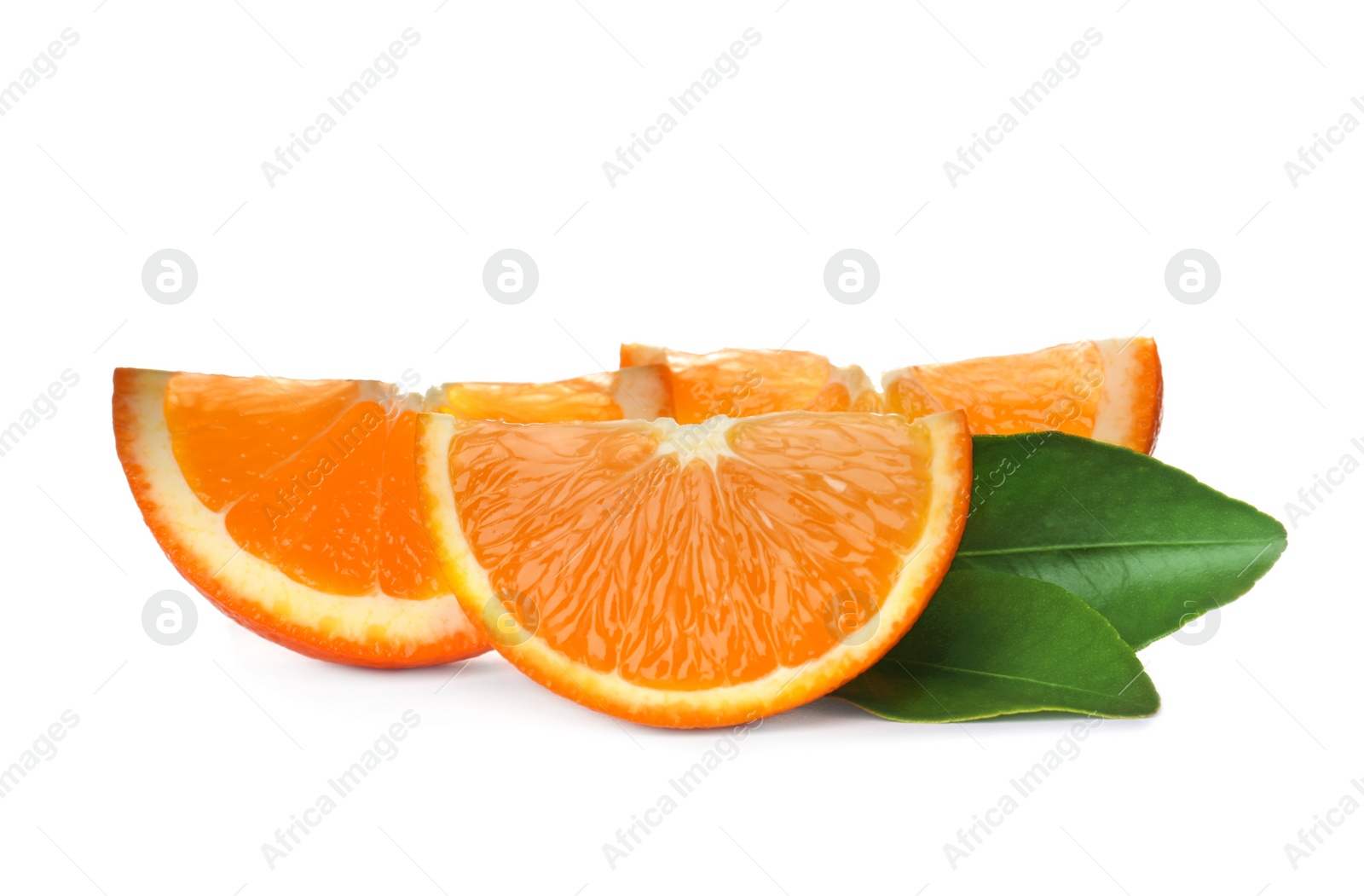 Photo of Slices of ripe orange with leaves isolated on white