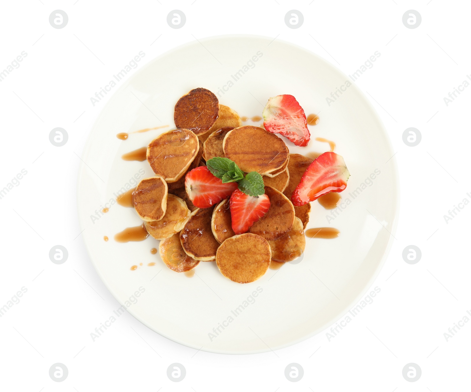 Photo of Plate with cereal pancakes and strawberries isolated on white, top view