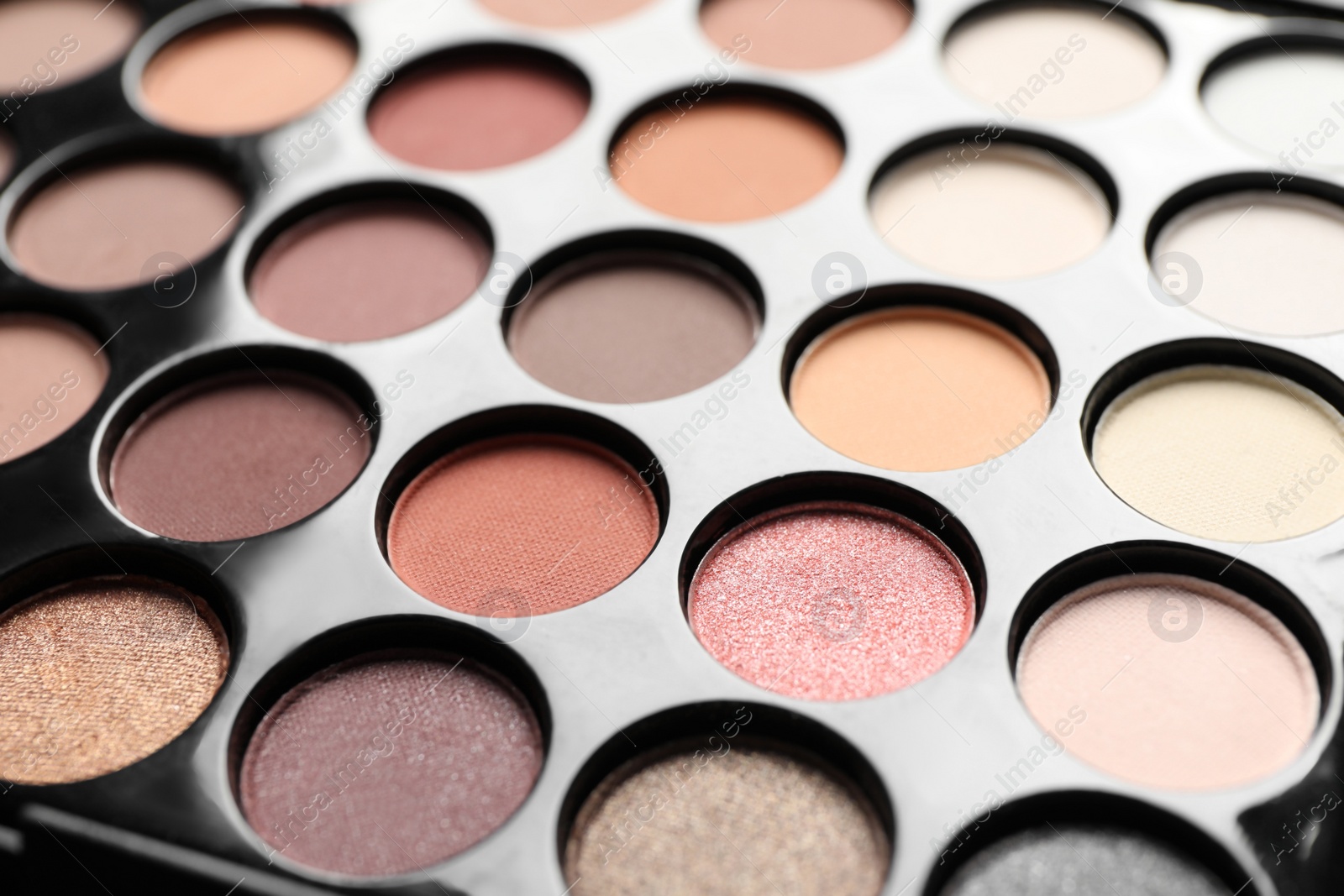 Photo of Beautiful basic eye shadow palette as background, closeup