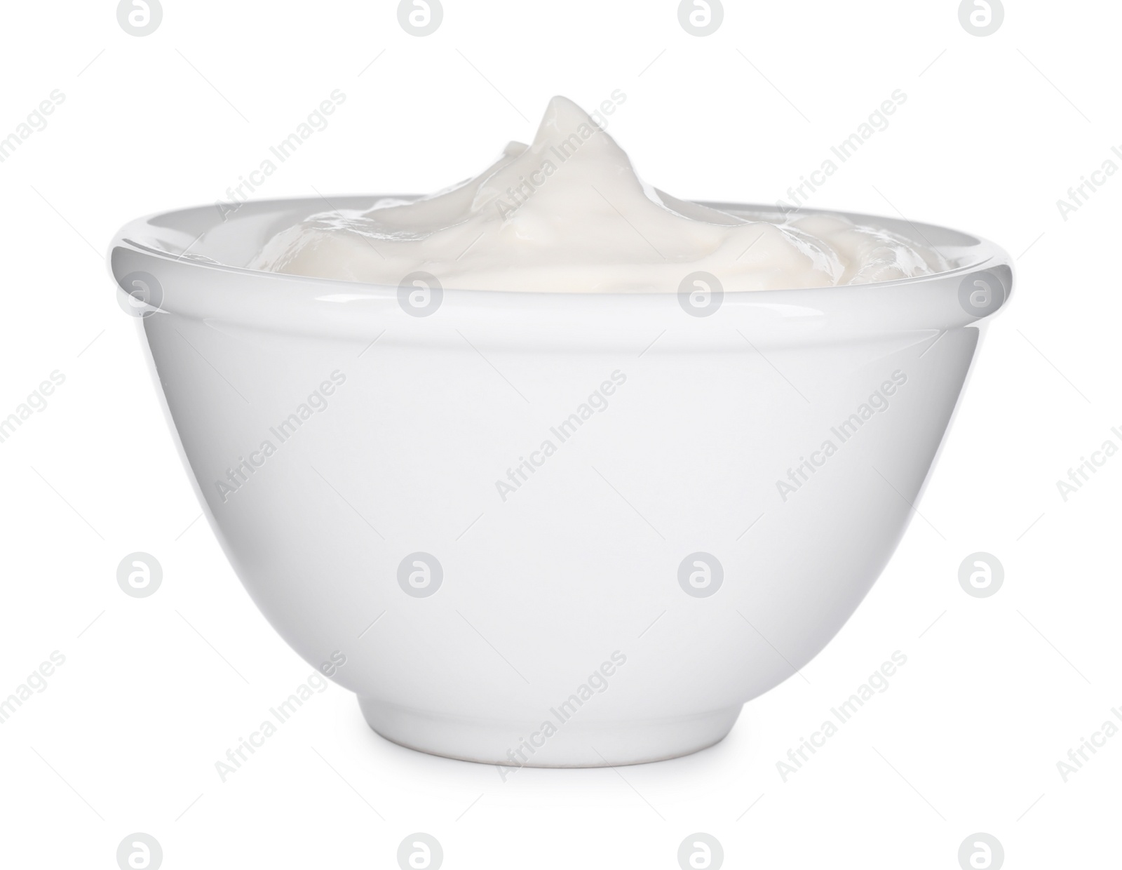 Photo of Bowl with sour cream isolated on white