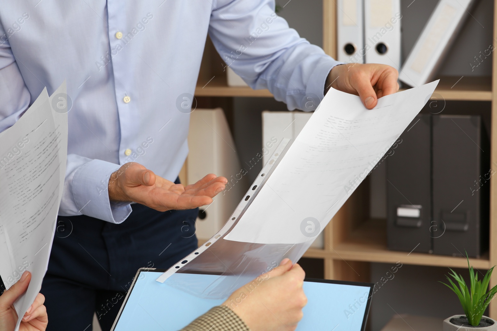 Photo of Businesspeople working with documents in office, closeup