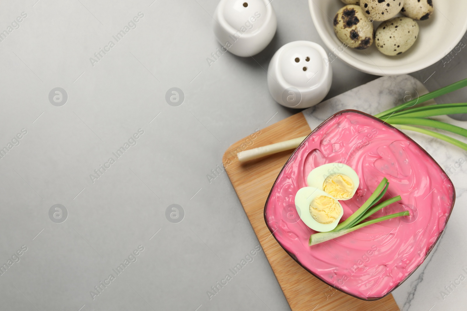 Photo of Herring under fur coat salad on white table, flat lay with space for text. Traditional Russian dish