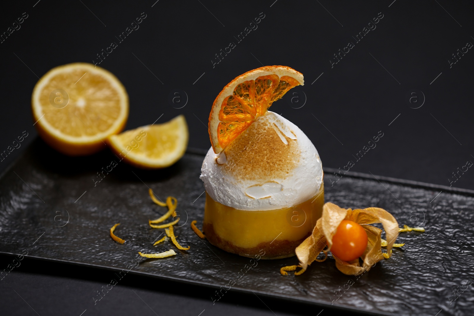 Photo of Beautiful composition of delicious dessert on black background, closeup. Food stylist