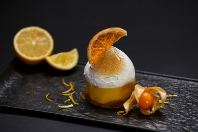 Photo of Beautiful compositiondelicious dessert on black background, closeup. Food stylist