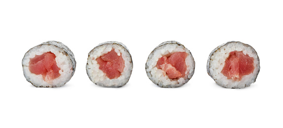 Photo of Delicious sushi rolls with tuna on white background